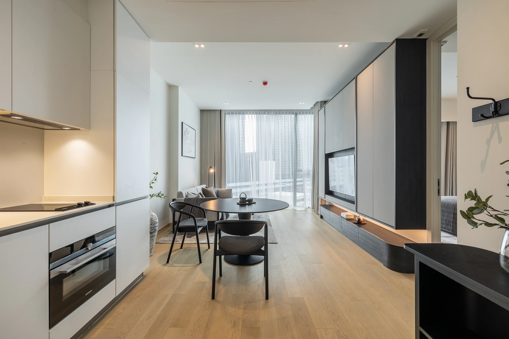 The Strand Thonglor — Warm Layered Residence